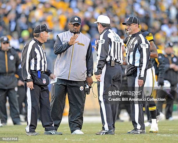 Head coach Mike Tomlin discusses a play with the referee during a game on December 27, 2009 against the Baltimore Ravens at Heinz Field in...