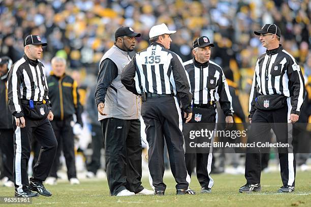 Head coach Mike Tomlin discusses a play with the officials during a game on December 27, 2009 against the Baltimore Ravens at Heinz Field in...