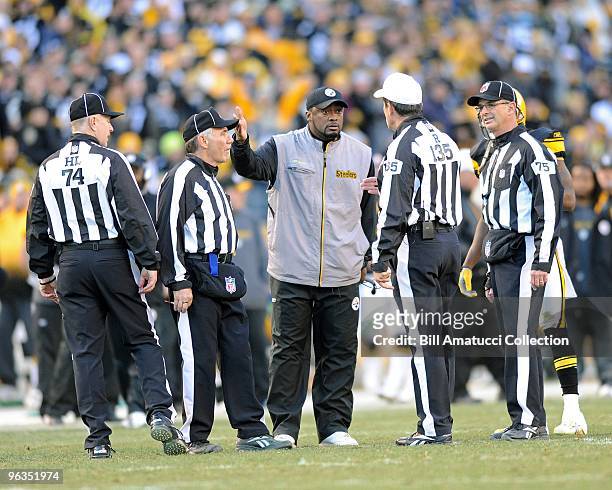Head coach Mike Tomlin discusses a play with the referee during a game on December 27, 2009 against the Baltimore Ravens at Heinz Field in...