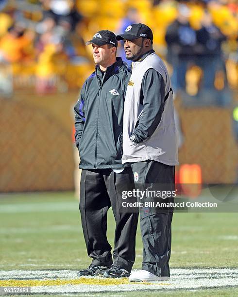 Head coach Mike Tomlin of the Pittsburgh Steelers talks with head coach John Harbaugh of the Baltimore Ravens prior to a game on December 27, 2009 at...