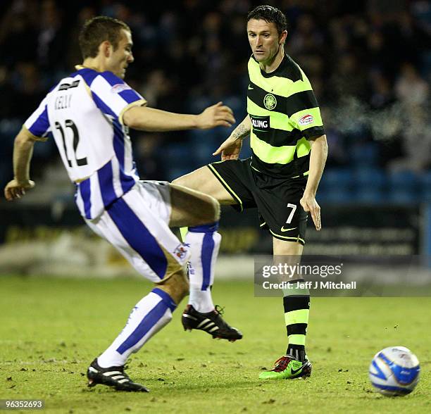 Liam Kelly of Kilmarnock tackles Robbie Keane of Celtic during the Clydesdale Bank Scottish Premier League match between Kilmarnock and Celtic at...