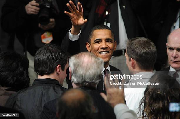 President Barack Obama waves to the crowd following a town hall meeting February 2, 2010 at Nashua North High School in Nashua, New Hampshire....