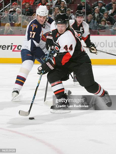 Kimmo Timonen of the Philadelphia Flyers handles the puck against Pavel Kubina of the Atlanta Thrashers on January 28, 2010 at the Wachovia Center in...