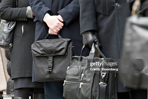 People wait to enter U.S. Bankruptcy Court in New York, U.S., on Tuesday, Feb. 2, 2010. The judge overseeing the liquidation of Bernard Madoff's...