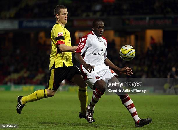 Heidar Helguson of Watford battles with Nyron Nosworthy of Sheffield United during the Coca-Cola Championship match between Watford and Sheffield...