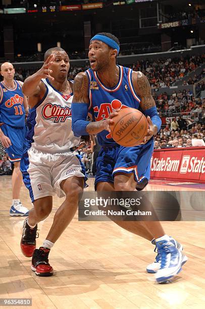 Mo Williams of the Cleveland Cavaliers drives the ball against Sebastian Telfair of the Los Angeles Clippers during the game on January 16, 2010 at...