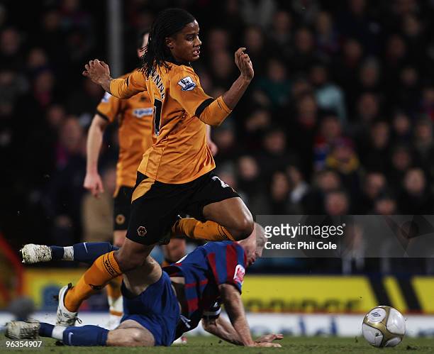 Michael Mancienne of Wolverhampton Wanderers evades Shaun Derry of Crystal Palace during the FA Cup sponsored by E.ON Final 4th round replay match...