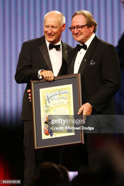 Legend Inductee Kevin Sheedy accepts his award from AFL commission chairman Richard Goyder during the Australian Football Hall of Fame at Crown...