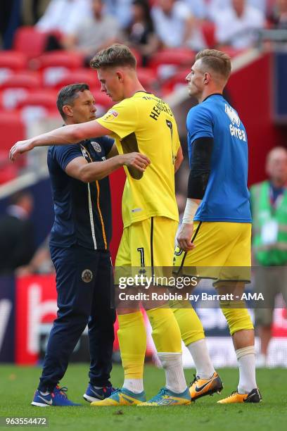 Dejected Dean Henderson of Shrewsbury Town is consoled by Paul Hurst, Manager / Head Coach of Shrewsbury Town during the Sky Bet League One Play Off...