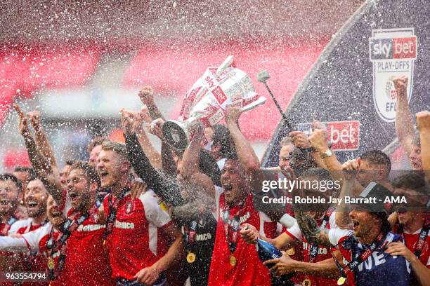 Richard Wood of Rotherham United lifts the EFL Sky Bet League One Play Off final trophy with his team mates during the Sky Bet League One Play Off...