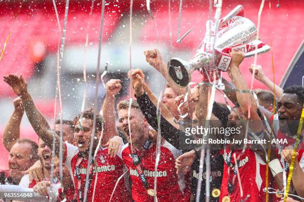 Richard Wood of Rotherham United lifts the EFL Sky Bet League One Play Off final trophy with his team mates during the Sky Bet League One Play Off...