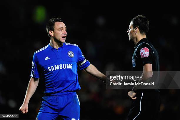 John Terry of Chelsea has words with Referee Mark Clattenburg during the Barclays Premier League match between Hull City and Chelsea at the KC...