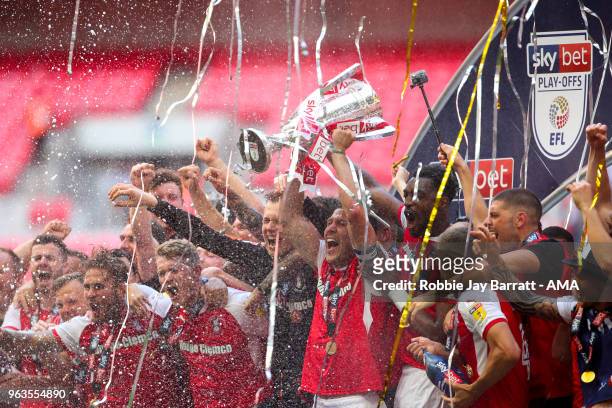 Richard Wood of Rotherham United lifts the EFL Sky Bet League One Play Off final trophy with his team mates during the Sky Bet League One Play Off...