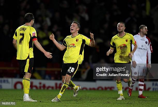 Don Cowie of Watford is congratulated by teammates Tom Cleverley and Henri Lansbury after he scored their 3:0 goal during the Coca-Cola Championship...