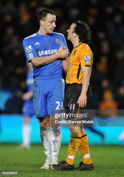 John Terry of Chelsea shakes hands with Stephen Hunt of Hull City at the end of the Barclays Premier League match between Hull City and Chelsea at...