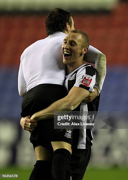 WIGAN, ENGLAND Stephen Hunt of Notts County celebrates with teammate Ben Davies after their victory over Wigan Athletic in the FA Cup sponsored by...