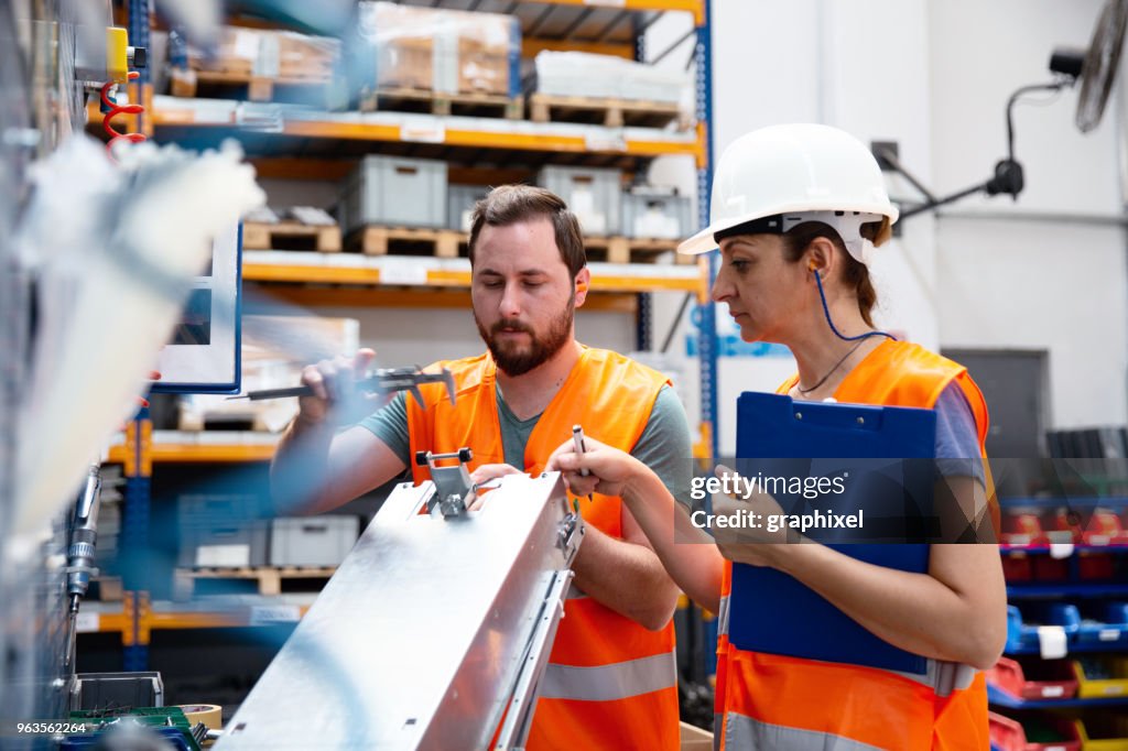 Assembly Supervisor Supervisor And Worker In Steel Factory High-Res Stock Photo - Getty Images
