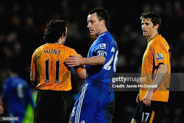 John Terry of Chelsea shakes hands with Stephen Hunt of Hull City at the end of the Barclays Premier League match between Hull City and Chelsea at...