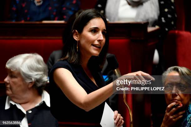 French Minister attached to the Minister of Ecological and Inclusive Transition Brune Poirson gestures as she speaks during a session of questions to...