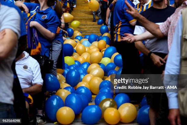Blue and yellow balloons are seen which are thrown by fans of Shrewsbury Town during the Sky Bet League One Play Off Final between Rotherham United...