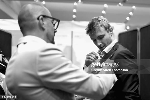 Sergey Sirotkin of Russia and Williams prepares backstage at the Amber Lounge Fashion show during previews ahead of the Monaco Formula One Grand Prix...