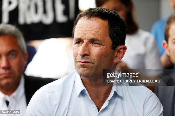 Benoit Hamon, leader of the left-wing political movement Generations , listens during a meeting with seven employees on hunger strike at the Centre...