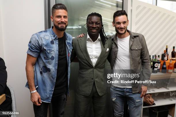 French soccer player Olivier Giroud, Bafe Gomis and Hugo Lloris attends the 2018 French Open - Day Three at Roland Garros on May 29, 2018 in Paris,...