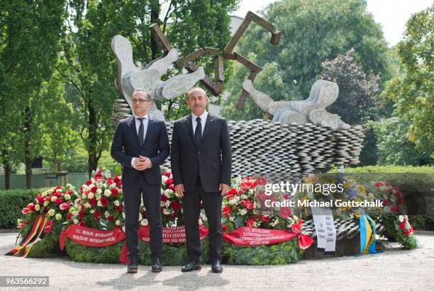 Heiko Maas, Foreign Minister of Germany and Mevlut Cavusoglu, Foreign Minister of Turkey, visit the memorial site of the arson attack on the house of...