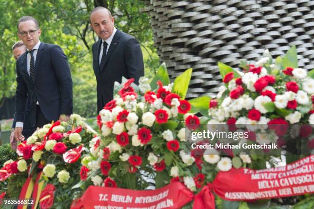 Heiko Maas, Foreign Minister of Germany and Mevlut Cavusoglu, Foreign Minister of Turkey, visit the memorial site of the arson attack on the house of...