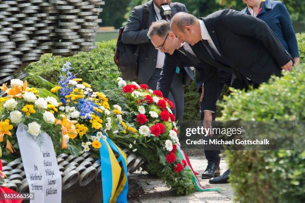 Heiko Maas, Foreign Minister of Germany and Mevlut Cavusoglu, Foreign Minister of Turkey, visit the memorial site of the arson attack on the house of...