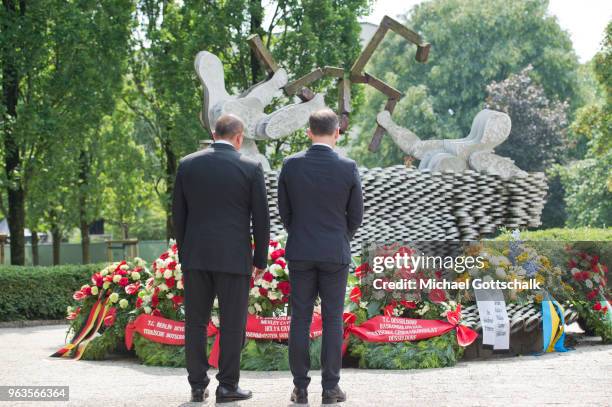 Heiko Maas, Foreign Minister of Germany and Mevlut Cavusoglu, Foreign Minister of Turkey, visit the memorial site of the arson attack on the house of...