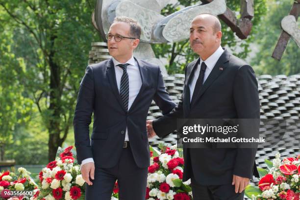 Heiko Maas, Foreign Minister of Germany and Mevlut Cavusoglu, Foreign Minister of Turkey, visit the memorial site of the arson attack on the house of...