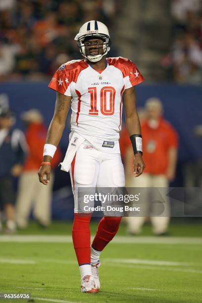 Quarterback Vince Young of the Tennessee Titans walks on the field during the 2010 AFC-NFC Pro Bowl at Sun Life Stadium on January 31, 2010 in Miami...