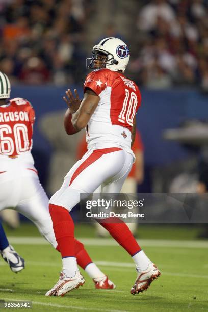 Quarterback Vince Young of the Tennessee Titans drops back to pass during the 2010 AFC-NFC Pro Bowl at Sun Life Stadium on January 31, 2010 in Miami...