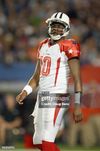 Quarterback Vince Young of the Tennessee Titans walks on the field during the 2010 AFC-NFC Pro Bowl at Sun Life Stadium on January 31, 2010 in Miami...