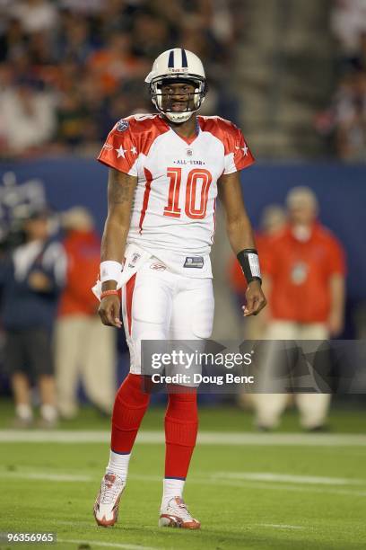 Quarterback Vince Young of the Tennessee Titans walks on the field during the 2010 AFC-NFC Pro Bowl at Sun Life Stadium on January 31, 2010 in Miami...