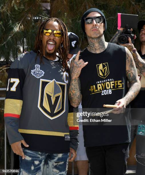 Rapper Lil Jon and Blink-182 drummer Travis Barker pose as they wait to perform at Toshiba Plaza outside T-Mobile Arena before Game One of the 2018...
