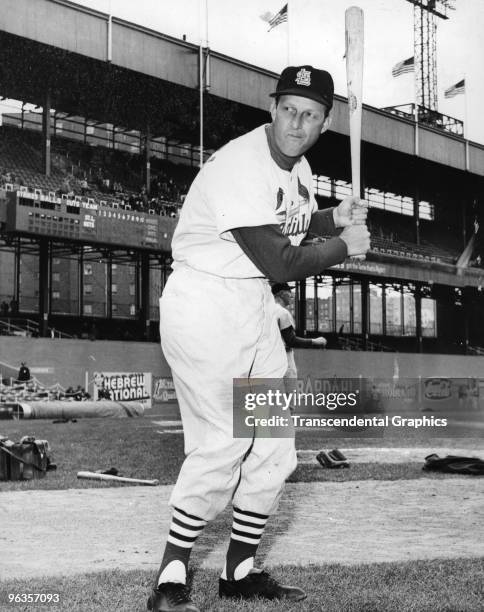 Stan Musial of the St. Louis Cardinals poses with a bat in New York's Polo Grounds before a game against the New York Giants in 1949.