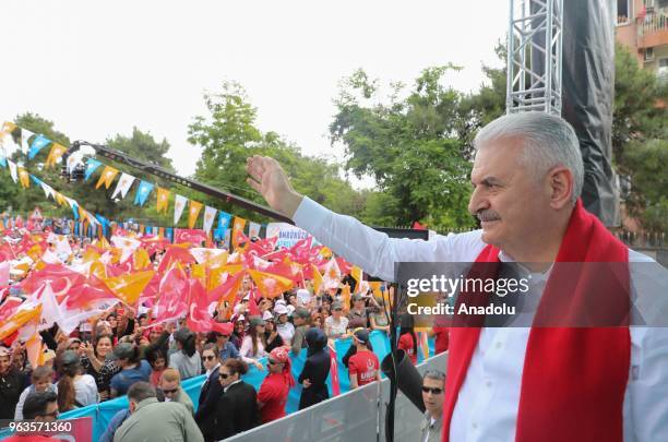 Turkish Prime Minister and Vice Chairman of Turkey's ruling Justice and Development Party, Binali Yildirim greets people during AK Party's rally in...