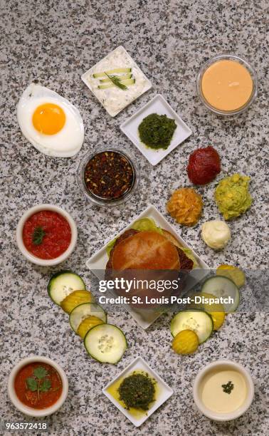 An array of toppings designed to make your burger better, on Wednesday, May 9 in the Post-Dispatch studio