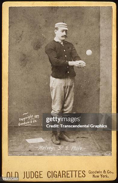 Joe Mulvey, third baseman for the Philadelphia Phillies, poses in a studio for a cabinet card photo issued by Goodwin & Co, for Old Judge Cigarettes...