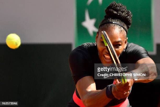 Serena Williams of the US plays a backhand return to Czech Republic's Kristyna Pliskova during their women's singles first round match on day three...