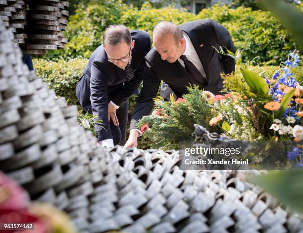 German Minister of Foreign Affairs Heiko Maas and the Turkish Foreign Minister Mevluet Cavusoglu visit the memorial in Solingen on May 29, 2018....