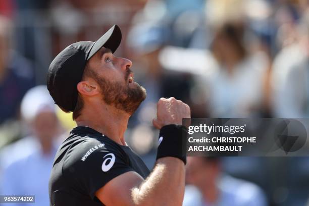 Steve Johnson of the US reacts after a point against France's Adrian Mannarino during their men's singles first round match on day three of The...