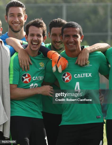 Robbie Kruse, Brad Jones, Mathew Leckie and Tim Cahill of Australia pose for a group photo during the Australian Socceroos Training Session at the...