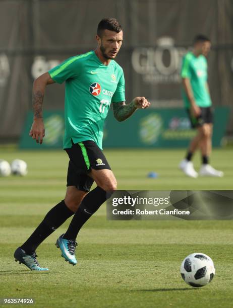 Nikita Rukavytsya of Australia runs with the ball during the Australian Socceroos Training Session at the Gloria Football Club on May 29, 2018 in...