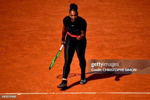 Serena Williams of the US reacts after a point against Czech Republic's Kristyna Pliskova during their women's singles first round match on day three...