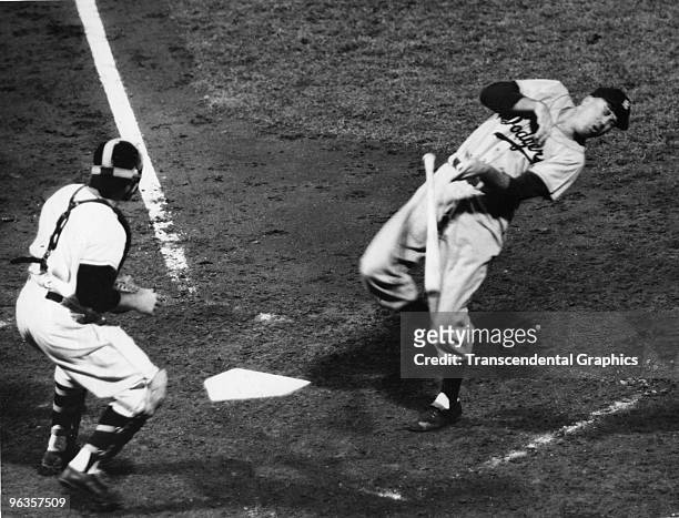Brooklyn Dodgers' Duke Snider is hit by a pitch in a game with the New York Giants in 1951. The Giants catcher is Wes Westrum.