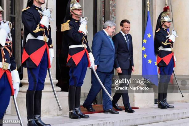 French President Emmanuel Macron welcomes Algerian Prime Minister Ahmed Ouyahia prior to an international conference on Libya at the Elysee...