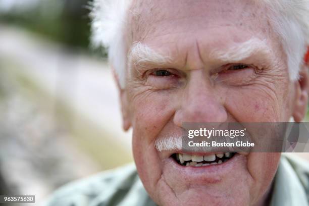 Stone mason Bill Doherty poses for a portrait while repairing a stone wall at Xaverian Brothers High School in Westwood, MA on May 18, 2018. While...